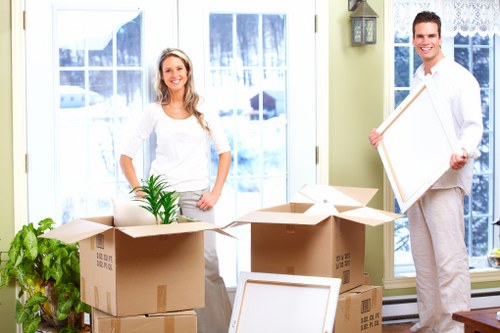 Professional movers assisting with loading